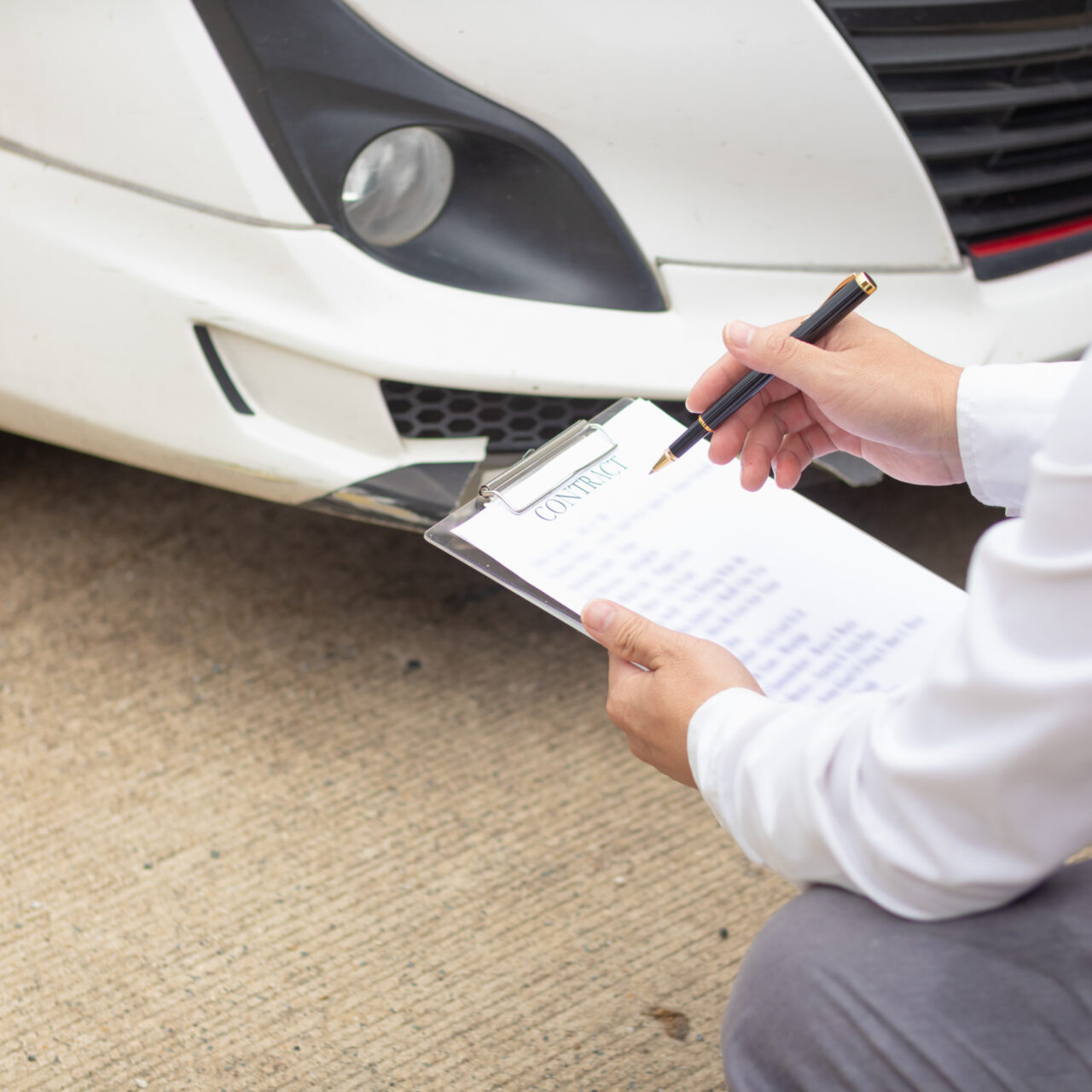 Insurance agents meet with customers when accidents occur to inspect damage and document insurance claims expeditiously. concept of car insurance agents to urgently inspect damage for customers. Man inspecting car with checklist clipboard.